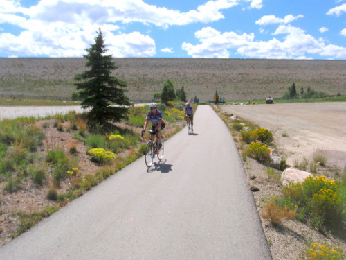 Cyclists riding down the connecting bike trail from Lake Dillon's bike trail.